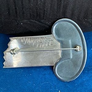 Mignon Faget column pin; signed. Stamped Sterling. Excellent condition.